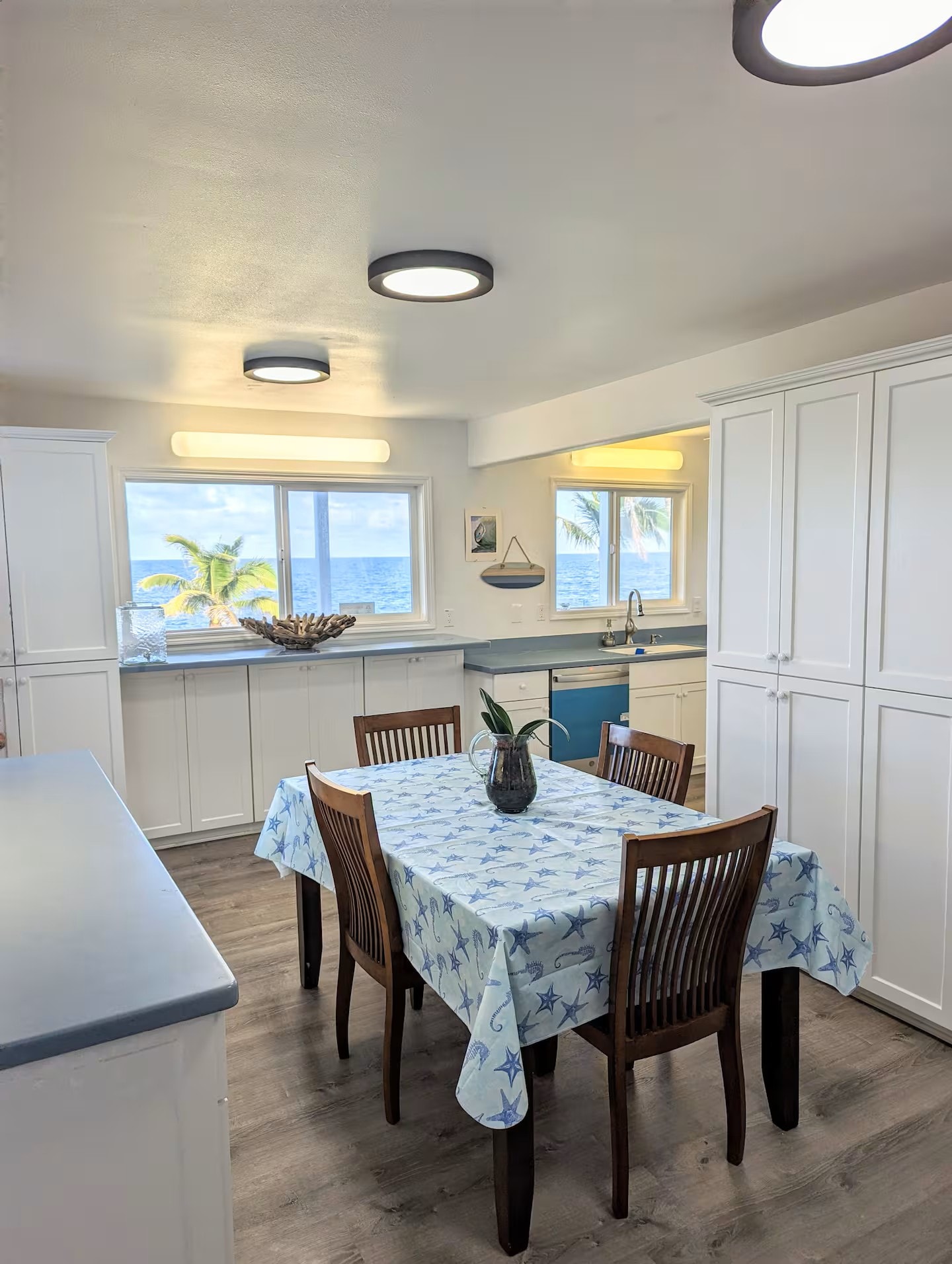 Fully equipped kitchen and dining area with ocean view